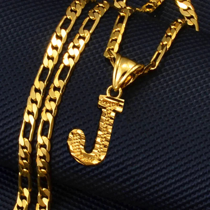 Gold plated pendant necklace with initial 'J', featuring a Figaro chain, unisex.