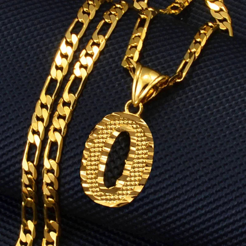 Gold plated letter pendant necklace on figaro chain for unisex wear.