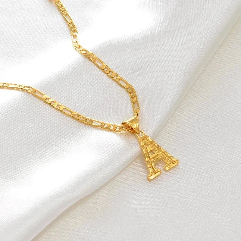 Gold plated initial letter pendant necklace on Figaro chain for unisex fashion.