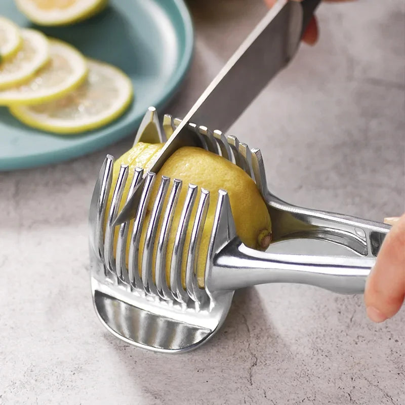 Stainless steel handheld slicer cutting lemon, featuring aluminum alloy blades.