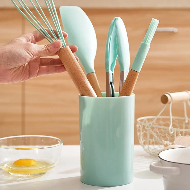 12-piece silicone non-stick kitchen utensils set with wooden handles, featuring spatula and egg beaters.