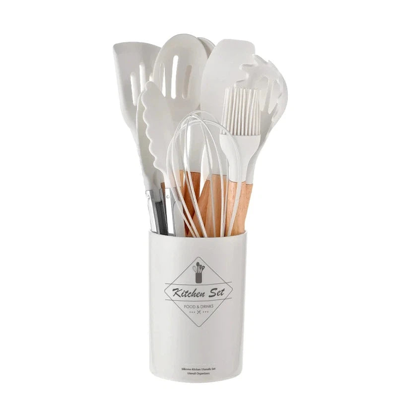 Non-stick silicone kitchen utensil set with wooden handles including spatula, shovel, and egg beaters in holder.