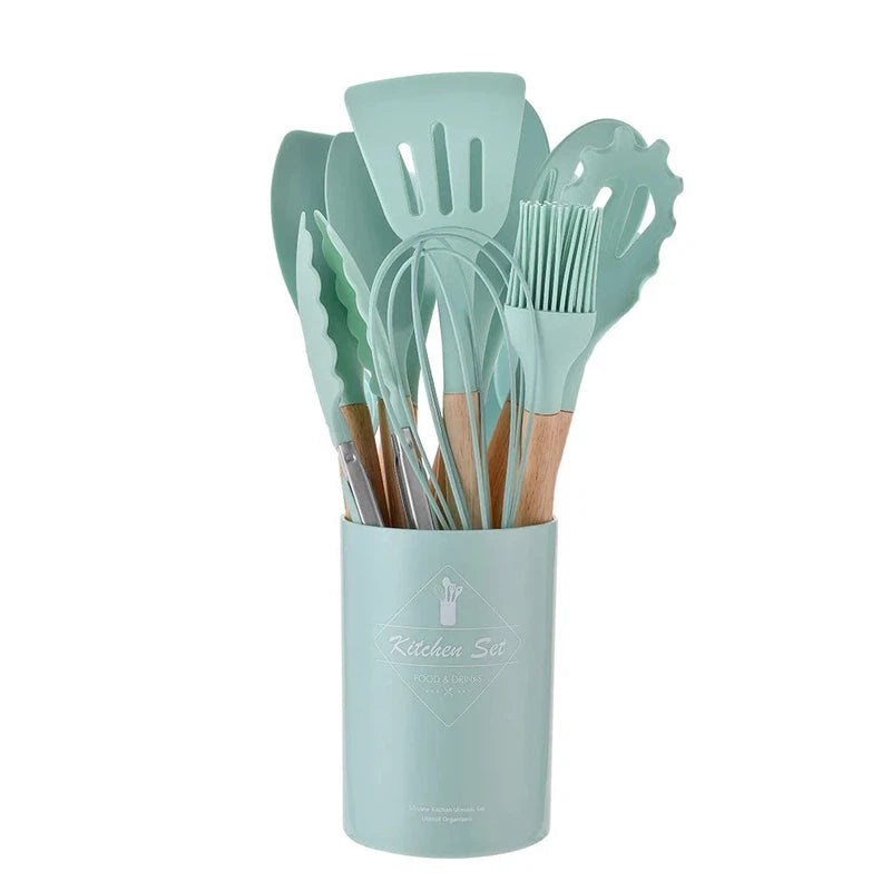 12-piece non-stick silicone kitchen utensil set with wooden handles, includes spatula, shovel, egg beaters, eco-friendly.