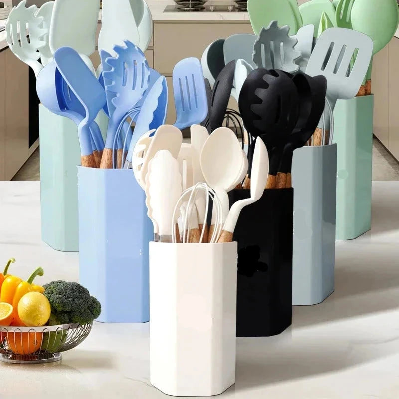 11-piece silicone cooking utensils set with wooden handles displayed in kitchen setting.