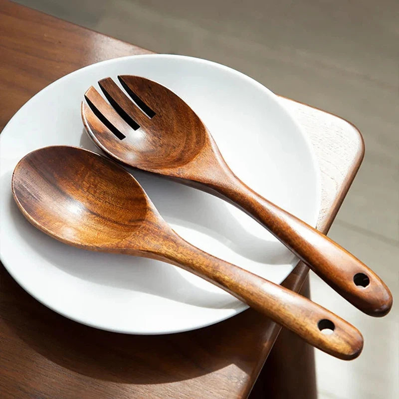 Wooden large spoon and fork set on a white plate, Japanese style long handle cutlery.