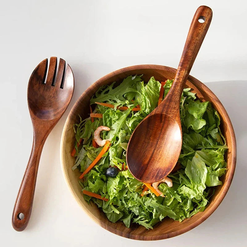 Japanese-style wooden large spoon and fork set with long handles for serving salad.