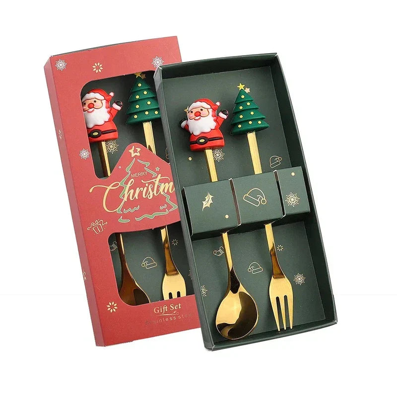 Christmas cutlery set with gold spoons and forks, Santa and tree decorations, ideal for gifts and dessert serving.