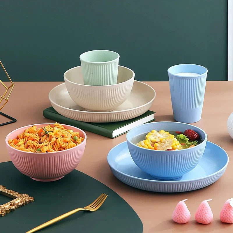 Eco-friendly 4-piece wheat straw tableware set with a plate, dish, bowl, and cup in pastel colors, perfect for camping and unbreakable kitchen use.