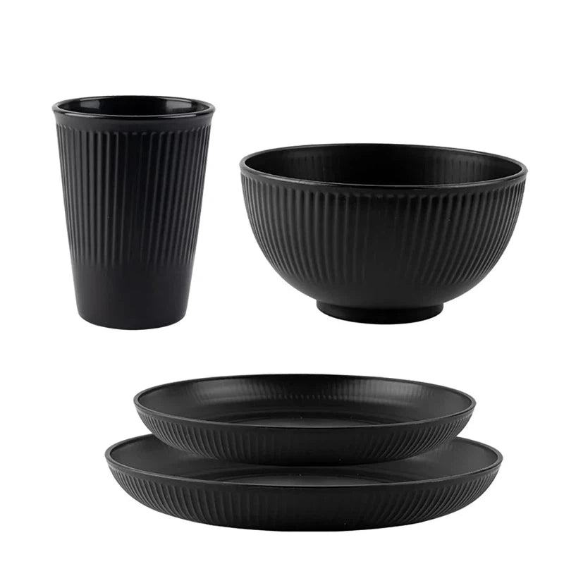 4-piece wheat straw tableware set including plate, dish, bowl, and cup, eco-friendly and unbreakable, ideal for camping.