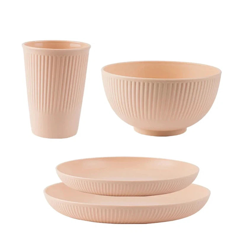 4-piece wheat straw tableware set including plate, bowl, and cup, eco-friendly and unbreakable for camping and kitchen use.