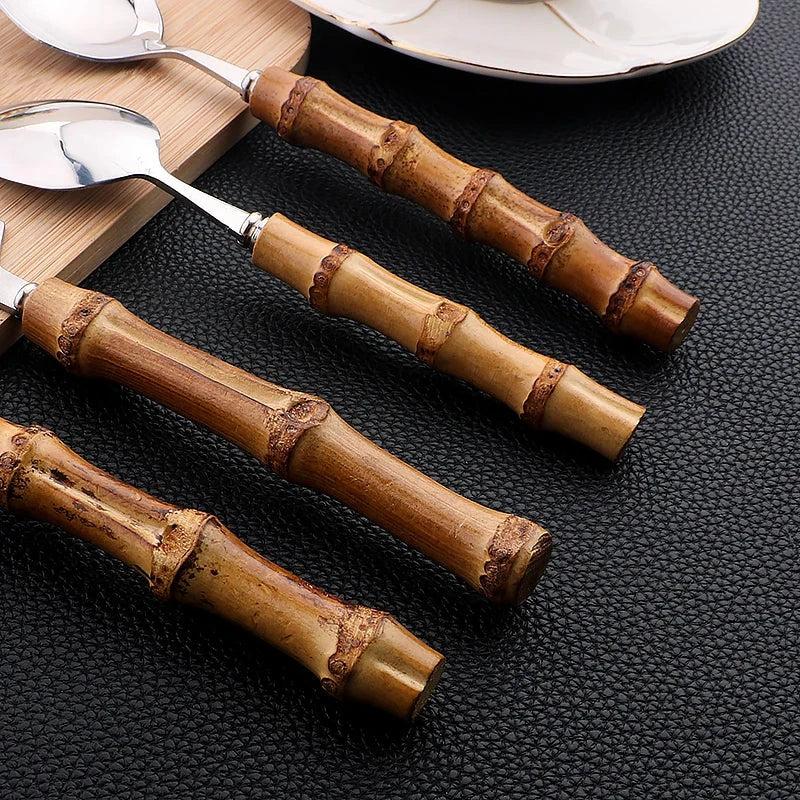 Bamboo handle stainless steel cutlery set, featuring knives, forks, spoons, and a luxury cutlery rack.