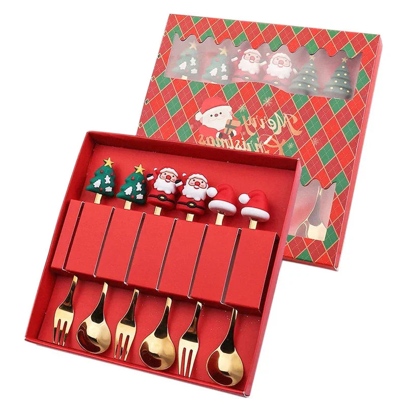 Christmas gift cutlery set with gold spoons and forks in decorative holiday box featuring elk and tree designs.