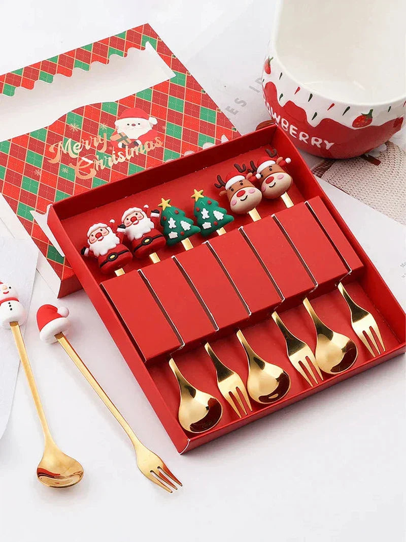 Christmas gift gold spoon and fork set with elk design and festive packaging.